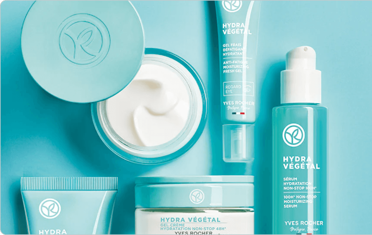 Yves Rocher Hydra Végétal skincare collection in teal packaging, including cream jar, serum, gel, and eye care products.